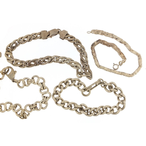 2057 - Five silver bracelets including a gate bracelet, 98.8g