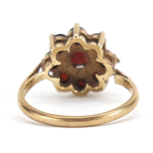 1790 - 9ct gold garnet flower head ring, size P, 3.4g