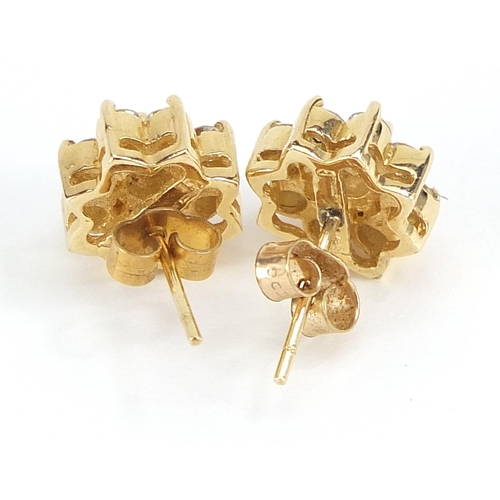 1630 - 14ct gold diamond flower head stud earrings, the largest diamond approximately 3.7mm in diameter, ov... 