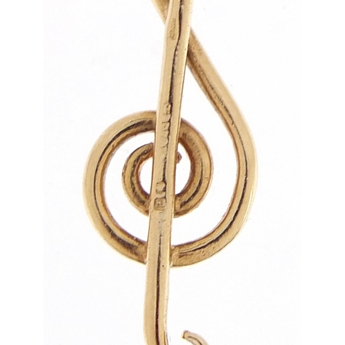 2142 - 9ct gold treble clef musical pendant, 3.0cm high, 1.0g