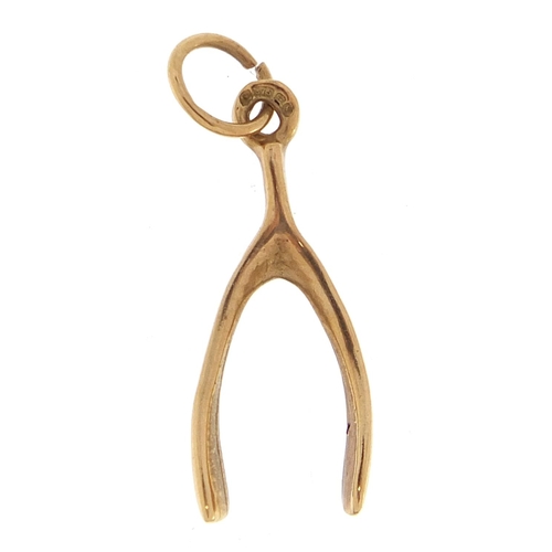 2126 - 9ct gold wishbone charm, 2.0cm high, 0.6g