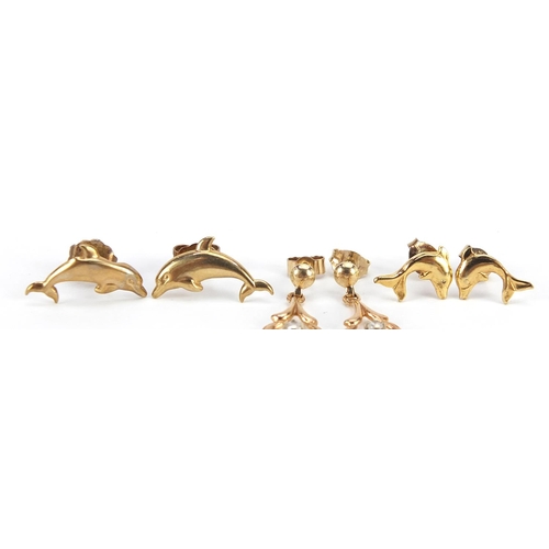 2117 - Two pairs of 9ct gold dolphin earrings and a pair of 9ct gold drop earrings set with clear stones, t... 