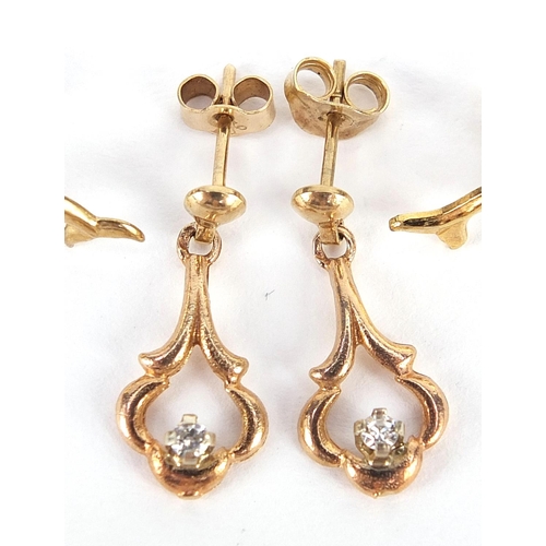 2117 - Two pairs of 9ct gold dolphin earrings and a pair of 9ct gold drop earrings set with clear stones, t... 