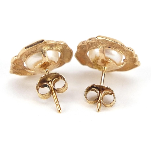 1813 - Pair of unmarked gold cultured pearl stud earrings, (tests as 9ct gold) 1.2cm in diameter, 2.0g