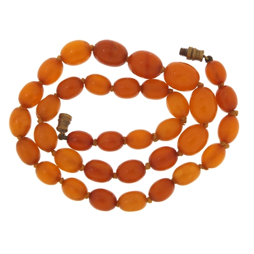 1859 - Butterscotch amber coloured graduated bead necklace, 38cm in length, 14.6g