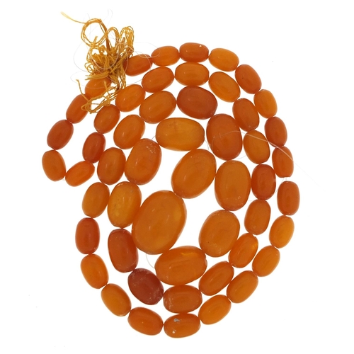 1886 - Amber coloured graduated bead necklace, 74cm in length, 48.8g