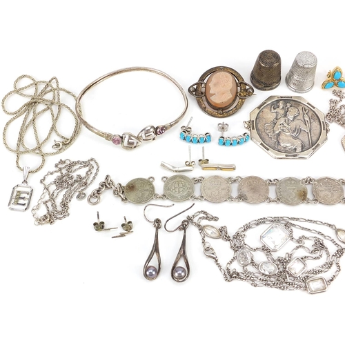 2150 - Silver and white metal jewellery including pendants on chains, thrupenny bit bracelet, large St Chri... 