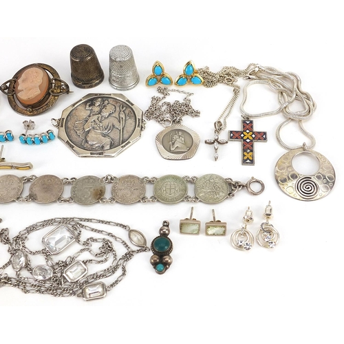 2150 - Silver and white metal jewellery including pendants on chains, thrupenny bit bracelet, large St Chri... 