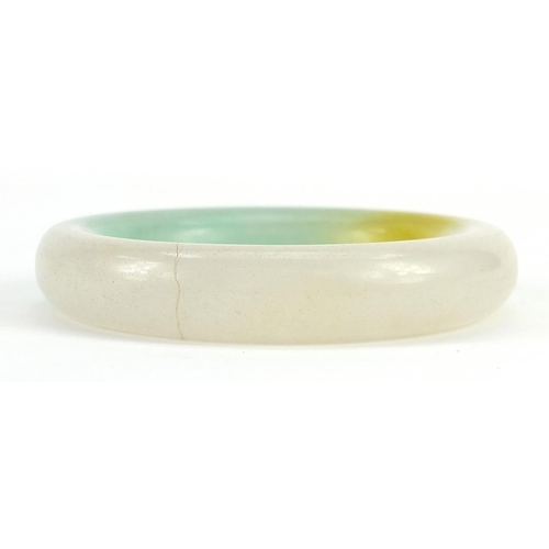 2153 - Chinese green and white jade bangle, 7.8cm in diameter, 70.5g