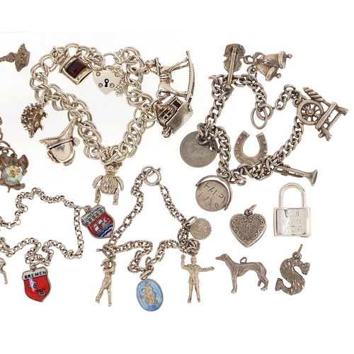 2064 - Seven silver charm bracelets with a selection of mostly silver charms, 123.8g