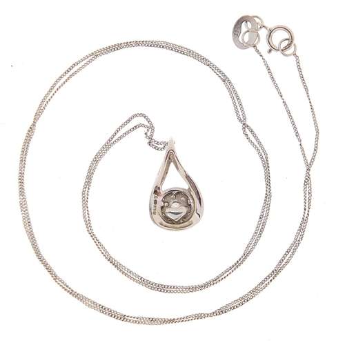 1726 - 9ct white gold diamond pendant on chain and matching stud earrings, the pendant 1.4cm high, total 2.... 