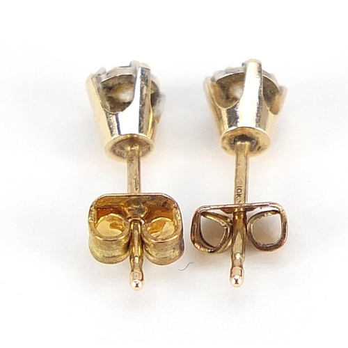 1800 - Pair of 10ct gold diamond solitaire stud earrings, 3cm in diameter, 0.6g