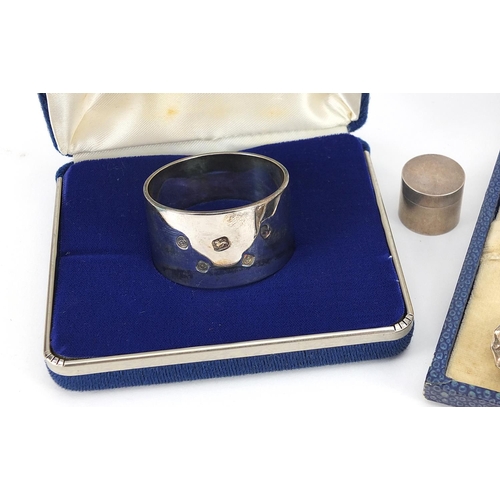 2287 - Silver objects comprising circular napkin ring with fitted case, set of four card suit coffee bean s... 