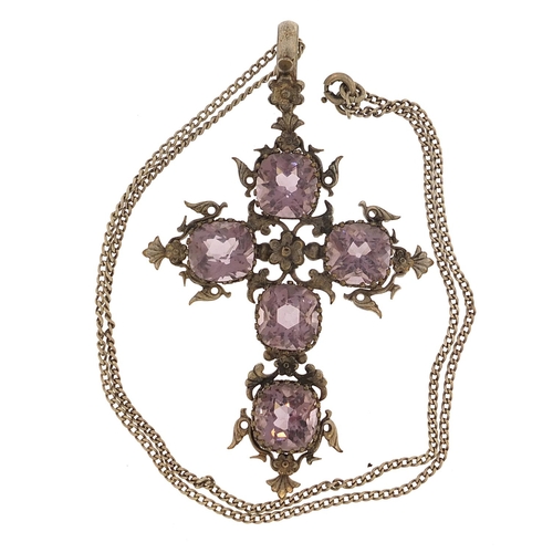 2035 - Large white metal cross pendant set with amethyst coloured stones on a white metal necklace, the pen... 