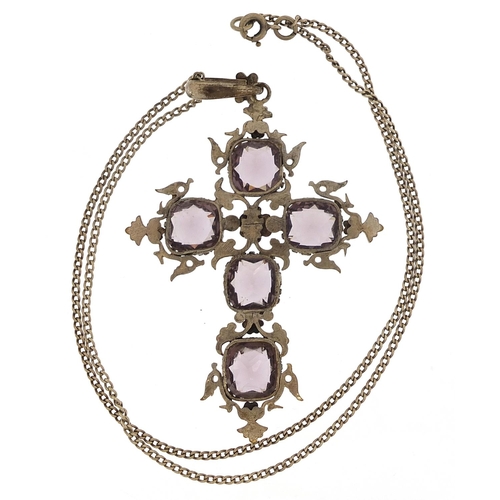 2035 - Large white metal cross pendant set with amethyst coloured stones on a white metal necklace, the pen... 