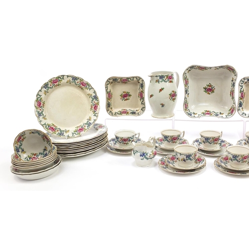 1335 - Booth's Floradora dinner and teaware, some by Royal Doulton including dinner plates, teacups and sau... 