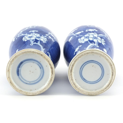 198 - Pair of Chinese blue and white porcelain baluster vases and covers hand painted with prunus flowers,... 