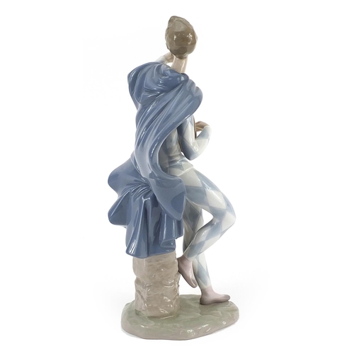 517 - Lladro porcelain figure of a man playing a mandolin, numbered 6332 to the base, 27.5cm high