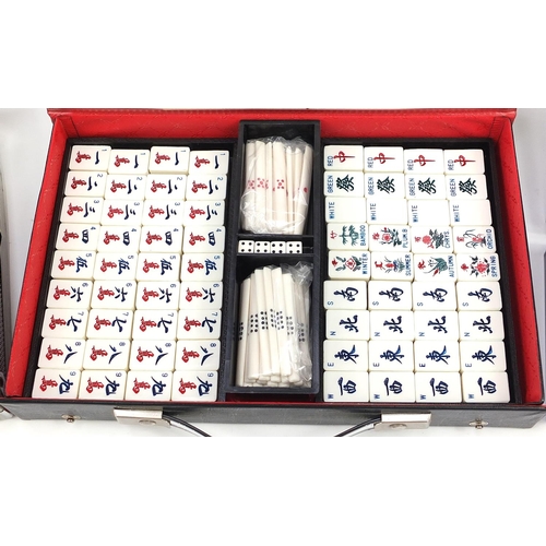 1514 - Poker chip set with carry case and Mahjong game, the poker chip case 58cm in length