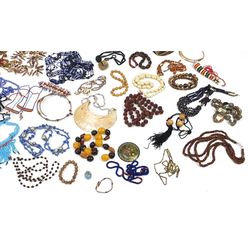 1387 - Middle Eastern jewellery including amber coloured beads, African beadwork and horn bead necklaces