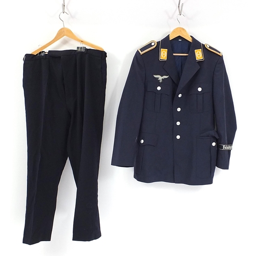 1564 - Three German military interest tunics and a pair of trousers