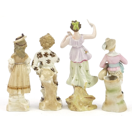 450 - Four 19th century continental porcelain figures including a pair hand painted with flowers, the pair... 