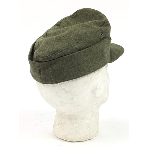 1565 - German military interest cap with cloth badge dated 1944 and with LACO stamp to the interior