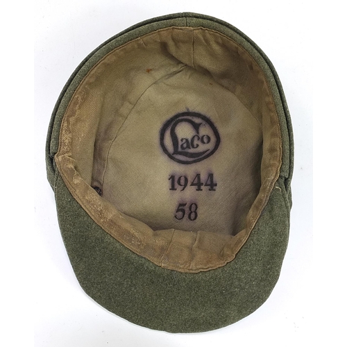 1565 - German military interest cap with cloth badge dated 1944 and with LACO stamp to the interior