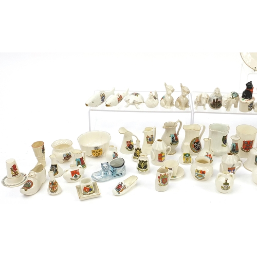 670 - Collection of crested china, some Goss including three handled tyg, animals and lighthouses