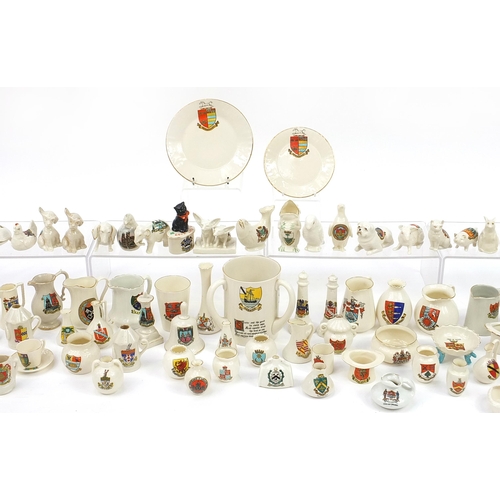 670 - Collection of crested china, some Goss including three handled tyg, animals and lighthouses