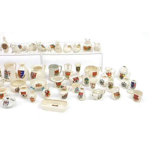 670 - Collection of crested china, some Goss including three handled tyg, animals and lighthouses