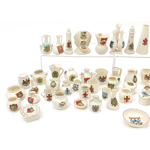 1362 - Collection of crested china, some Goss including shoes, lighthouses, cauldrons and cannon, the large... 