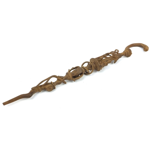 1210 - Tribal interest walking stick carved with figures and fish, 89.5cm in length