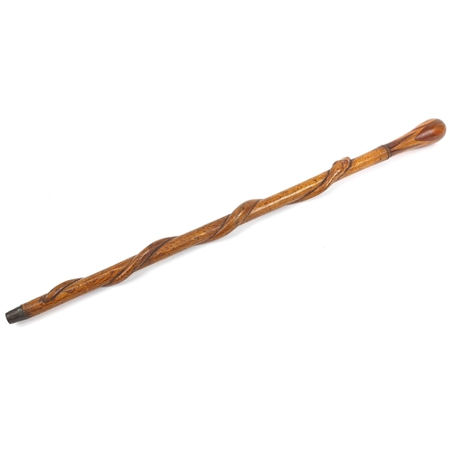 501 - Hardwood walking stick with inlaid handle carved with a serpent, 85cm in length