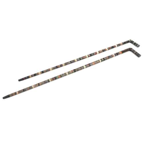 500 - Pair of specimen marble sectional walking sticks, each 89.5cm in length