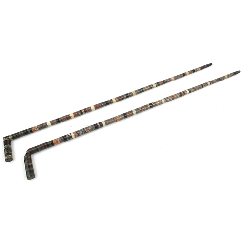 500 - Pair of specimen marble sectional walking sticks, each 89.5cm in length