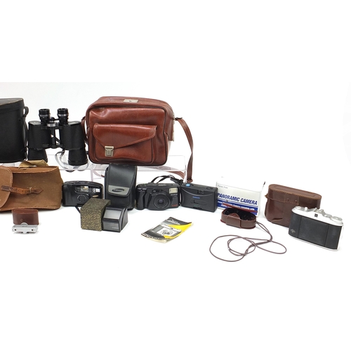 1340 - Vintage and later cameras, lenses and binoculars including Kodak, Olympus, Hanimex and Agfa