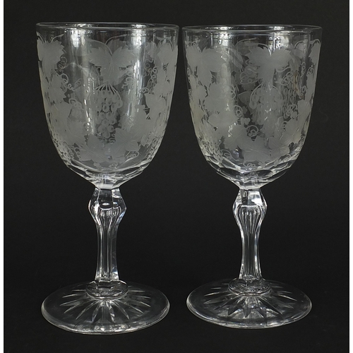 45 - Pair of Edwardian cut glasses etched with leaves and berries, each 18.5cm high