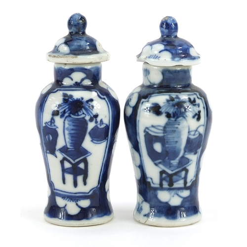 86 - Pair of miniature Chinese blue and white porcelain baluster vases with covers hand painted with luck... 