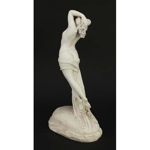 77 - Victorian Copeland style parian ware figurine of a nude female holding flowers, 32cm high