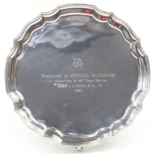 2221 - Elkington & Co Ltd, Elizabeth II circular silver salver raised on three scrolled feet with presentat... 