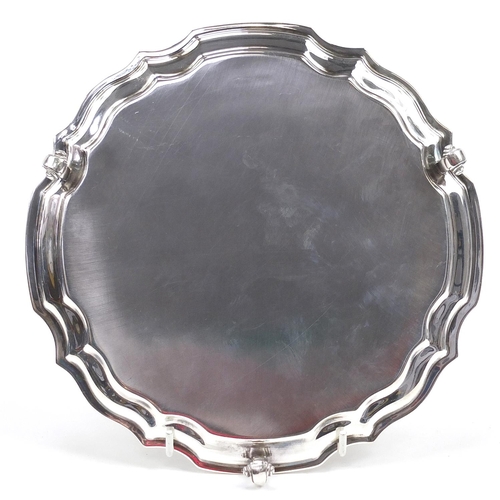 2221 - Elkington & Co Ltd, Elizabeth II circular silver salver raised on three scrolled feet with presentat... 