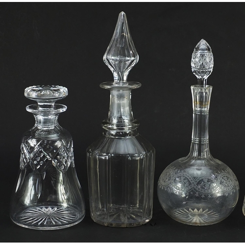 1304 - Five antique and later cut glass decanters with stoppers, one with etched decoration, the largest 33... 