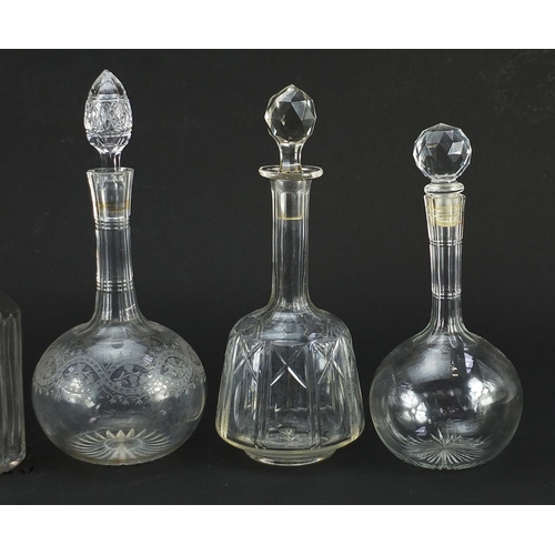 1304 - Five antique and later cut glass decanters with stoppers, one with etched decoration, the largest 33... 