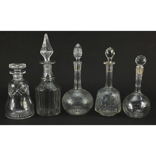 1304 - Five antique and later cut glass decanters with stoppers, one with etched decoration, the largest 33... 