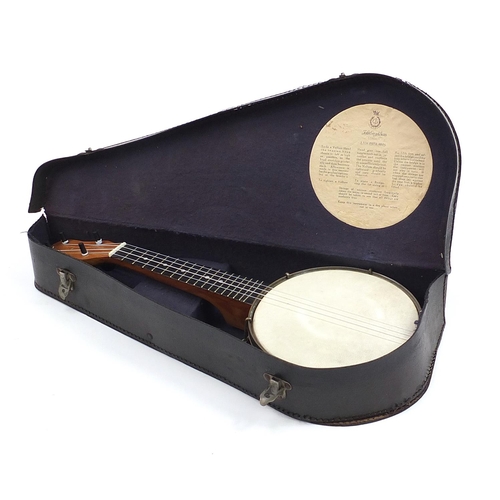 400A - John Grey & Sons Dulcetta ukulele banjo, with case and song book, 56cm in length