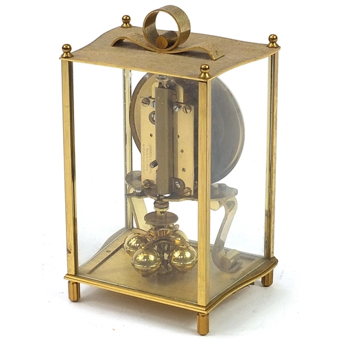 621 - Kundo brass cased anniversary clock, 21cm high