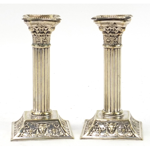 950 - Pair of Corinthian column silver plated candlesticks, 18cm high