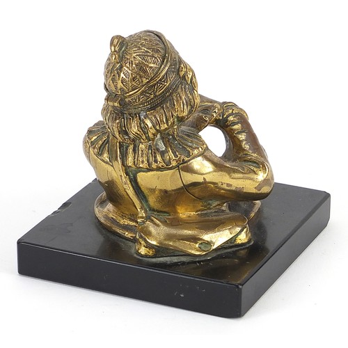 273 - Victorian bronzed pen holder in the form of an Arab man, raised on a square black slate base, 9cm hi... 