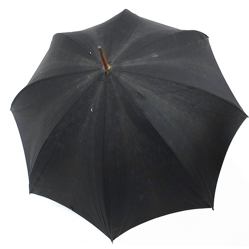 1207 - S Fox & Co parasol with naturalistic handle and silver pommel, 91cm in length